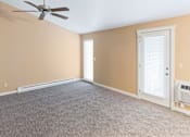 Thumbnail 63 of 73 - A room with a ceiling fan and carpeted floor at Graymayre Crossing Apartments, Spokane, WA, 99208