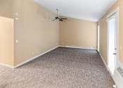 Thumbnail 64 of 73 - A room with a ceiling fan and carpeted floor at Graymayre Crossing Apartments, Spokane, WA, 99208