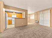 Thumbnail 21 of 73 - A kitchen area with a refrigerator, microwave, and oven at Graymayre Crossing Apartments, Spokane, 99208