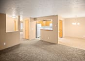 Thumbnail 24 of 73 - A spacious room with a refrigerator, cabinets, and a countertop at Graymayre Crossing Apartments, Spokane, WA, 99208