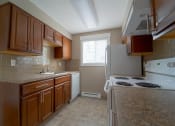 Thumbnail 10 of 43 - Modern Kitchen With Custom Cabinet at Railhead Apartments, Washington