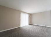 Thumbnail 12 of 43 - Carpeted Living Room at Railhead Apartments, Spokane, WA, 99202