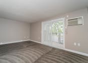 Thumbnail 13 of 43 - Spacious Living Room With Balcony at Railhead Apartments, Spokane, WA