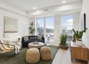 Thumbnail 1 of 63 - a living room with a couch and chairs and a table