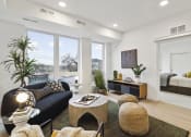 Thumbnail 6 of 63 - a living room with a couch and a coffee table