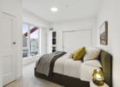 Thumbnail 12 of 63 - a bedroom with a large bed and a window