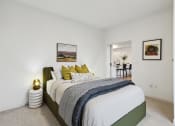 Thumbnail 11 of 63 - a bedroom with a large bed and white walls