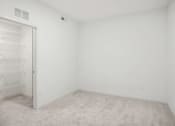 Thumbnail 51 of 63 - an empty room with white walls and a closet