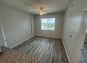 Thumbnail 9 of 22 - A room with a window and a ceiling fan. Madison Highlands 2 Tampa Florida