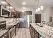 Thumbnail 17 of 23 - Warm Tone Kitchen, new, granite, lux, Senior Apartment, Senior living, Maplewood, White Bear Lake, Saint Paul, Frost English Silver