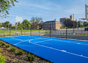 Thumbnail 13 of 13 - A blue basketball court with white lines and a basketball hoop.