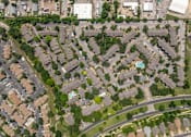 Thumbnail 14 of 35 - A bird's eye view of a residential area with houses and roads.