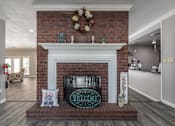 Thumbnail 33 of 35 - A fireplace with a sign that says "Spring" on it.