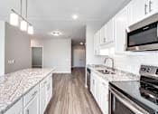 Thumbnail 19 of 23 - Cool Tone Kitchen, white, new, stainless, bright, Senior Apartment, Senior living, Maplewood, White Bear Lake, Saint Paul, Frost English Silver