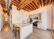 Thumbnail 2 of 41 - a kitchen with a white counter top and a sink at Greeley Lofts, St. Louis, 63102