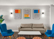 Thumbnail 1 of 48 - a living room with a couch and chairs and paintings on the wall