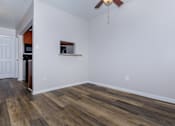 Thumbnail 25 of 25 - a living room with hardwood floors and a ceiling fan