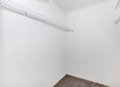 Thumbnail 12 of 31 - a small room with white walls and a white shelf on the wall