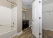 Thumbnail 6 of 31 - a bathroom with a bathtub and a sink
