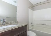 Thumbnail 5 of 31 - a bathroom with a sink toilet and bathtub