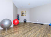 Thumbnail 26 of 31 - the spacious exercise room at the whispering winds apartments in pearland, tx