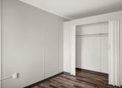 Thumbnail 24 of 48 - an empty room with white walls and a sliding closet door
