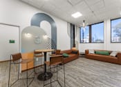 Thumbnail 41 of 61 - A modern office space with a large table and chairs.