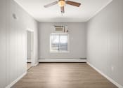 Thumbnail 28 of 48 - an empty room with a ceiling fan and a window