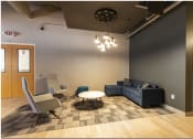 Thumbnail 25 of 28 - a lounge area with couches chairs and a coffee table