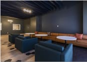 Thumbnail 23 of 28 - a lounge area with couches tables and chairs