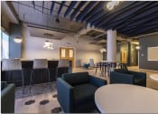 Thumbnail 17 of 28 - a large open space with chairs and tables