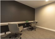 Thumbnail 15 of 28 - a small office with two desks and two chairs