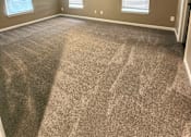 Thumbnail 15 of 27 - A room with a ceiling fan and carpeted floor.