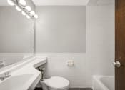 Thumbnail 39 of 48 - a white bathroom with a white toilet and a sink
