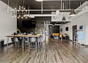 Thumbnail 8 of 19 - A modern dining area with a long table and chairs. at Vivo Toledo Apartments, Toledo, Ohio