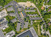 Thumbnail 15 of 19 - A bird's eye view of a residential area with houses, roads, and a parking lot. at Vivo Toledo Apartments, Toledo, OH, 43607