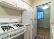 Thumbnail 2 of 22 - White kitchen appliances with white cabinetry