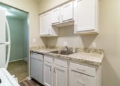 Thumbnail 4 of 22 - White kitchen with stainless steel sink