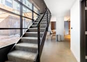 Thumbnail 24 of 40 - staircase with a metal railing at Life At Agora, Cleveland