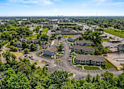 Thumbnail 14 of 19 - A bird's eye view of a residential area with houses and greenery. at Vivo Toledo Apartments, Ohio