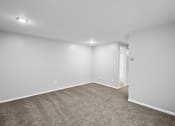 Thumbnail 1 of 35 - an empty living room with carpet and white walls