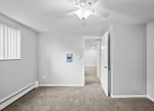 Thumbnail 9 of 35 - an empty room with carpet and a ceiling fan