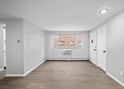 Thumbnail 19 of 35 - an empty room with white walls and a window