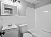 Thumbnail 29 of 35 - a bathroom with a sink toilet and a bath tub