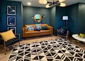Thumbnail 19 of 19 - A living room with a couch, a chair, and a rug. at Vivo Toledo Apartments, Toledo