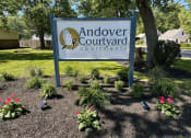 Thumbnail 10 of 10 - a sign operations in front of a garden