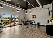 Thumbnail 9 of 19 - A modern kitchen with a dining table and chairs. at Vivo Toledo Apartments, Ohio, 43607
