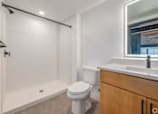 Thumbnail 11 of 40 - white toilet sits in bathroom at Life At Agora, Cleveland, OH