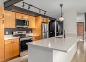 Thumbnail 12 of 40 - kitchen with white countertop at Life At Agora, Cleveland, OH