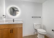 Thumbnail 18 of 40 - white toilet sits next to a sink at Life At Agora, Ohio, 44103